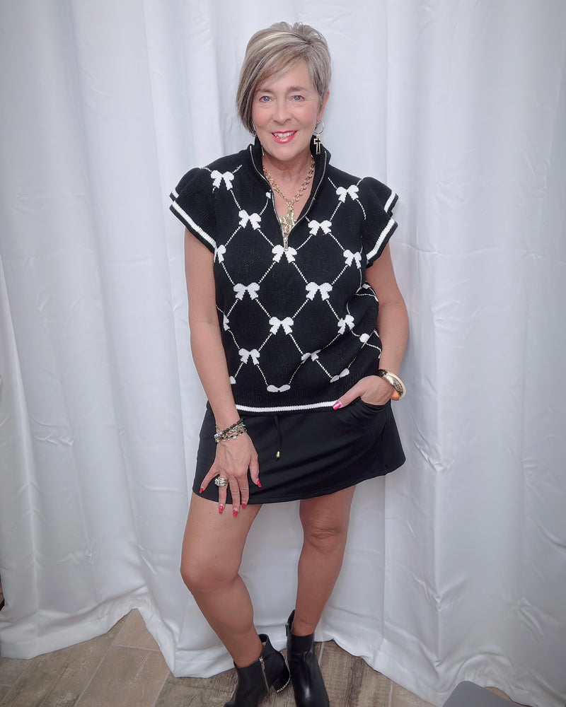 Black w/White Bow Zip Neck Ruffle Cap Sleeve Knit Sweater Vest Top