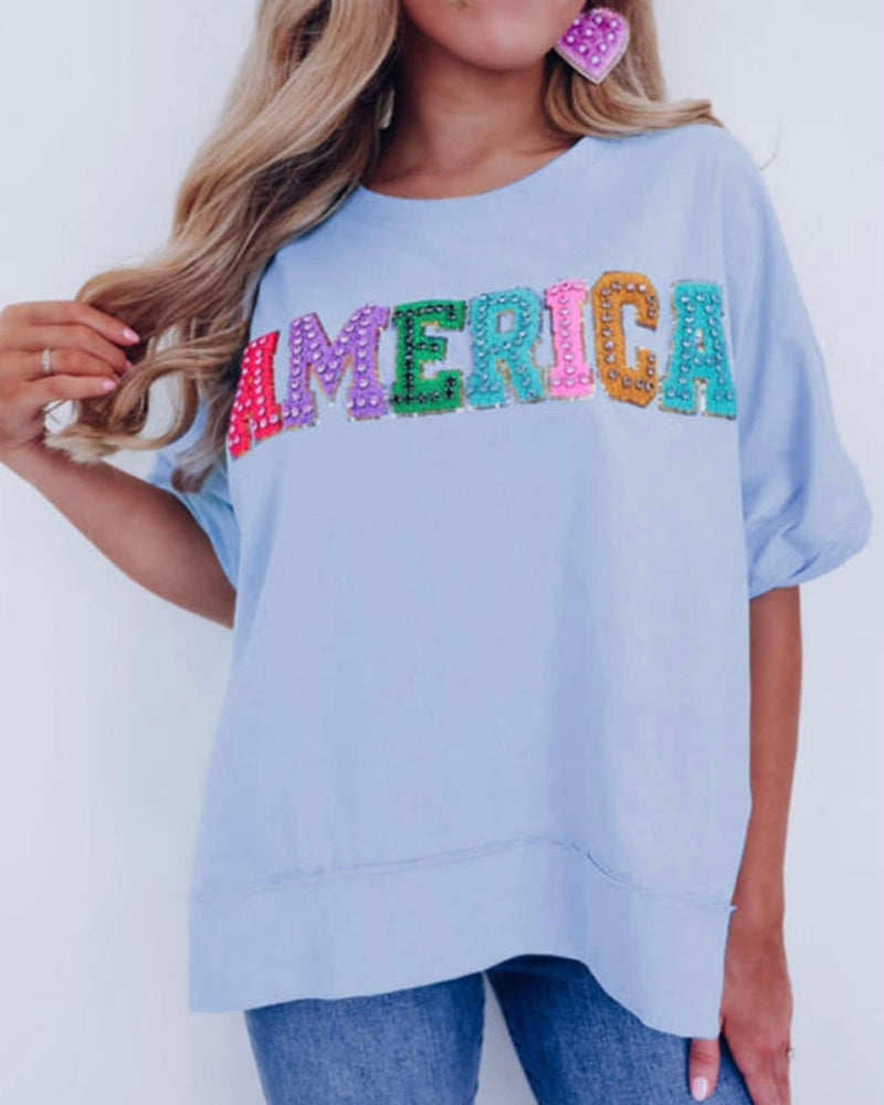 Light Blue Short Sleeve T-shirt Top with Pastel Multicolor Sequin Puff ‘America’
